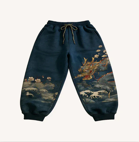 Navy blue streetwear joggers with dragon and wave print, elastic ankle cuffs, relaxed fit