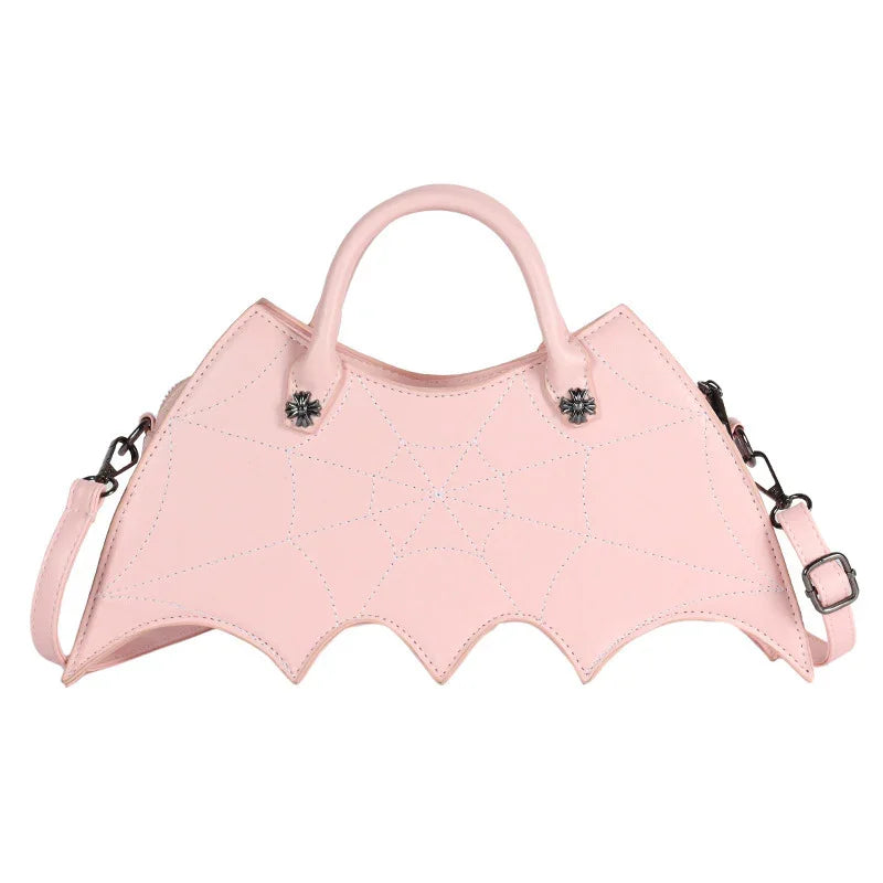 Pastel pink faux leather handbag with spider web stitching and batwing shape, detachable strap