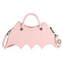 Pastel pink faux leather handbag with spider web stitching and batwing shape, detachable strap