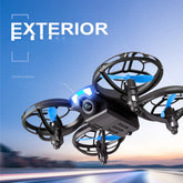 Black and blue quadcopter drone with LED lights flying outdoors at sunset