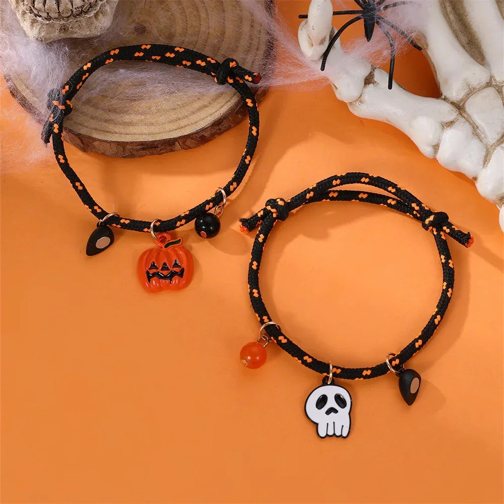 Black and orange braided rope bracelets with Halloween pumpkin and skull charms.