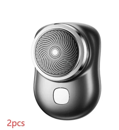 Compact metallic electric shaver with ergonomic grip, circular foil design, and modern finish