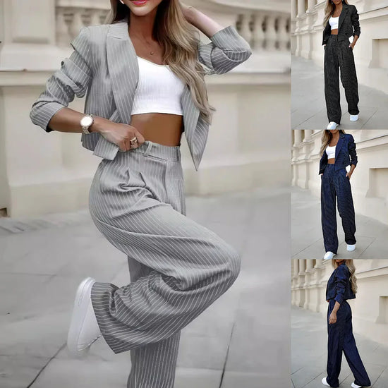 Women’s pinstripe suit set with cropped blazer, wide-leg pants, and ribbed white crop top in gray, black, and navy color options, relaxed fit, lightweight material.