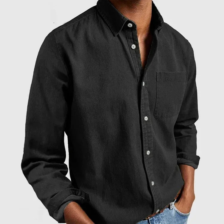 Men's black button-up long sleeve shirt, cotton material, relaxed fit, chest pocket.