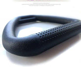 Close-up of a black textured carabiner with perforated grip, matte finish