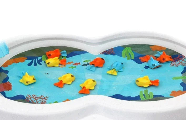 Colorful plastic toy fish floating in a white water basin with a blue aquatic pattern