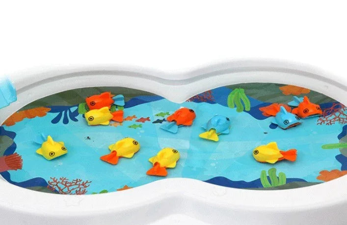 Colorful plastic toy fish floating in a white water basin with a blue aquatic pattern