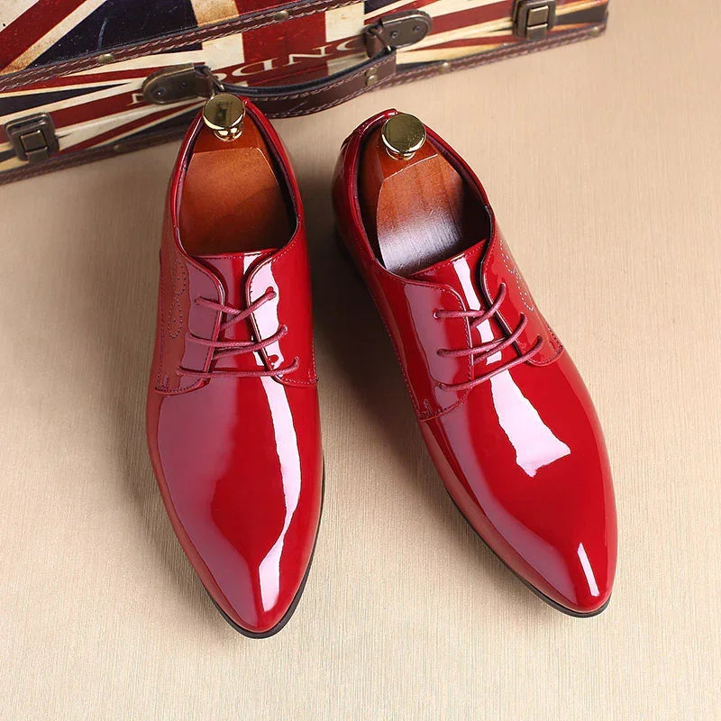 Glossy red patent leather dress shoes with lace-up closure and sleek pointed toe