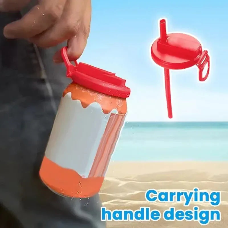 Person holding a drink container with red lid and straw, carrying handle design, beach background