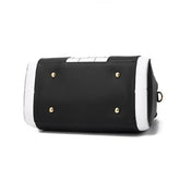 Black and white faux leather bag with gold studs and structured rectangular base
