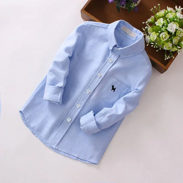Light blue long-sleeve button-up shirt with front pocket, embroidered animal, and classic fit.