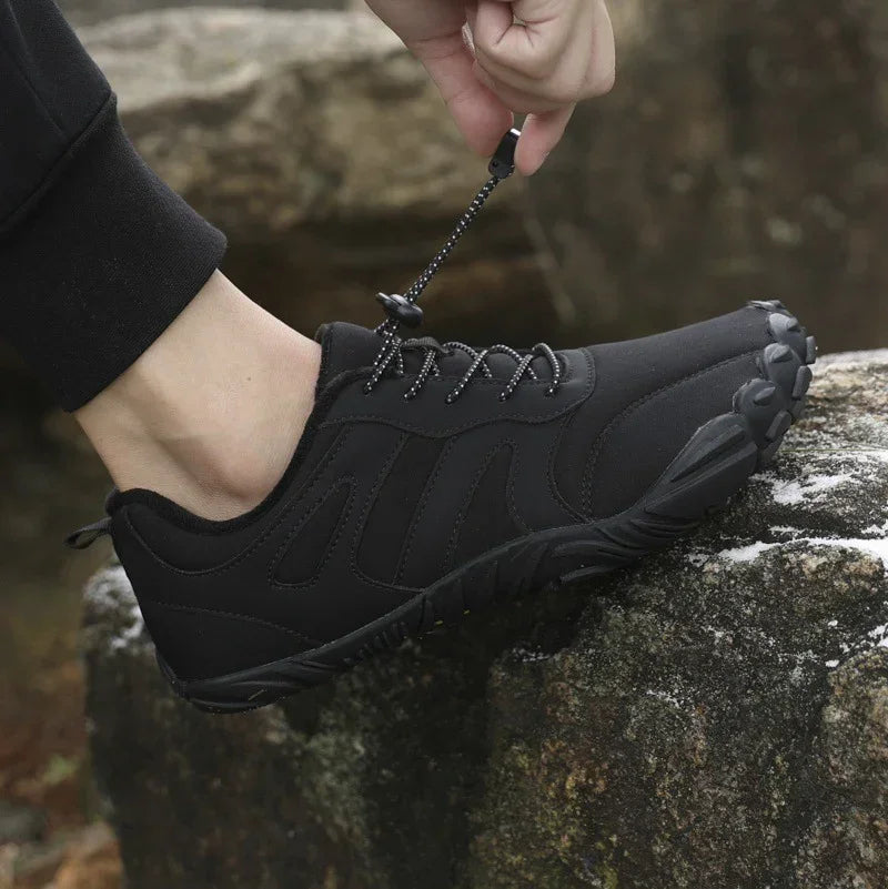 Black athletic outdoor sneaker with rugged sole and adjustable drawstring lace, slip-resistant fit