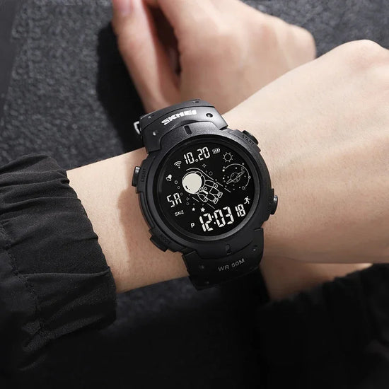 Black digital watch with space-themed display, worn on wrist, matte finish, sporty style
