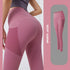 High-waisted pink sports leggings with mesh panels, slim fit, stretchy activewear.