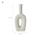 Modern white ceramic vase with hollow center, matte finish, tall rectangular shape, 24cm x 10cm