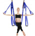 Woman in black sports bra and leggings on blue aerial yoga swing, fitted athletic wear