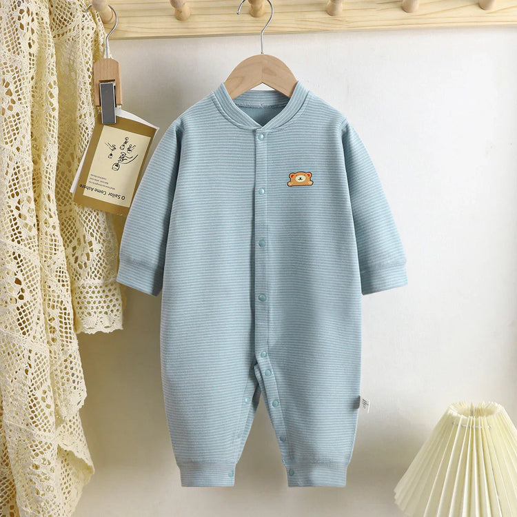 Light blue striped baby romper with long sleeves and bear patch, cotton material, relaxed fit