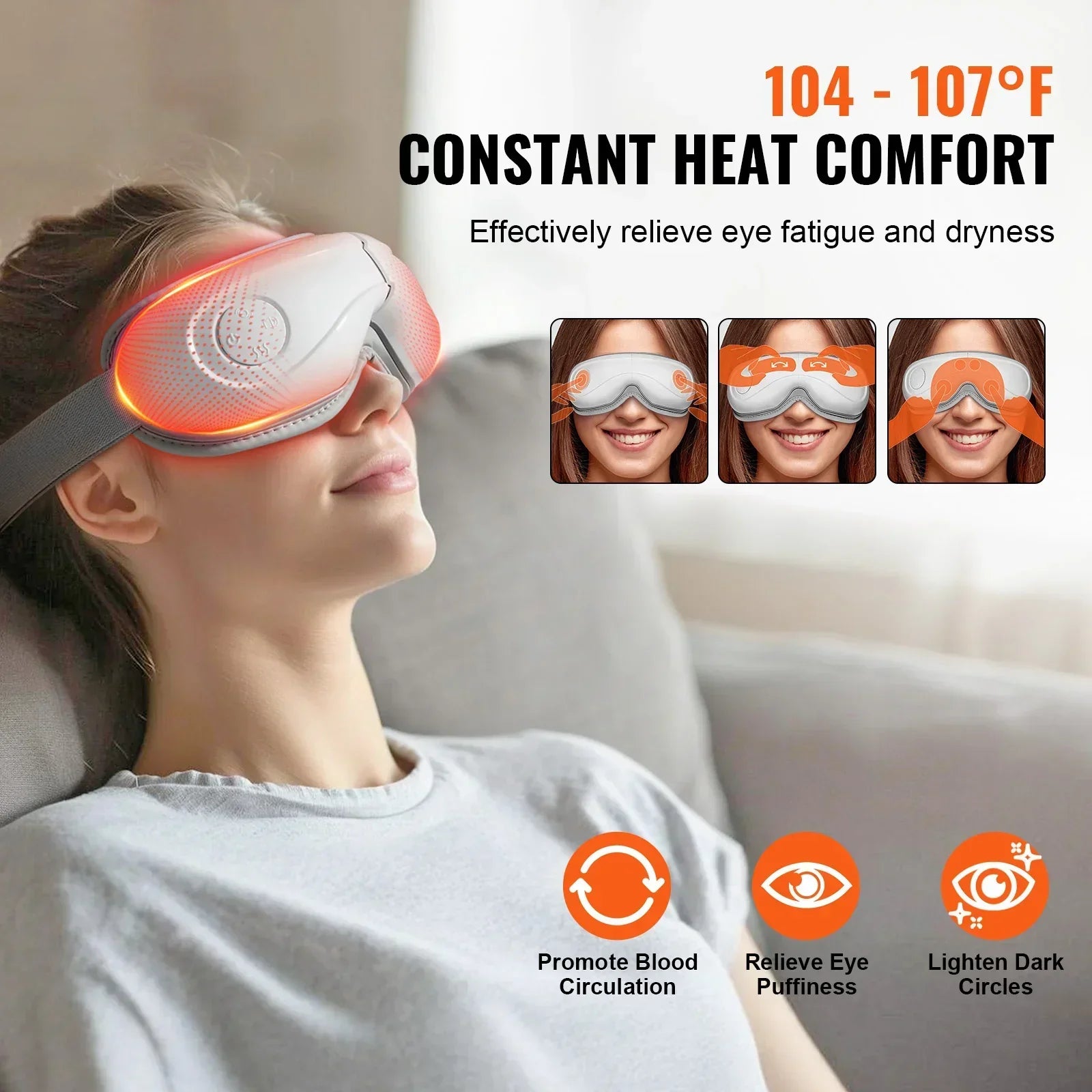 Woman wearing a gray heated eye massager with adjustable fit and LED lights, relaxing indoors