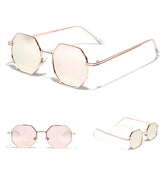 Octagonal rose gold sunglasses with pink-tinted lenses and thin metal frame, modern fit