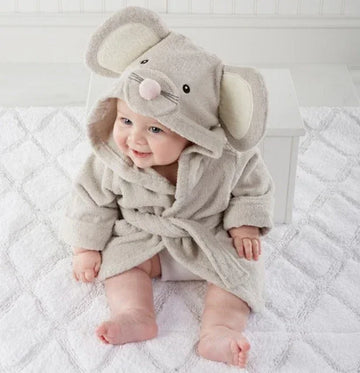Baby in soft grey hooded mouse robe with ears, plush fabric, relaxed fit, sitting on blanket