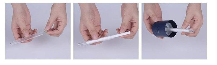 Hands assembling and placing a white plastic pen into a dark blue cylindrical case