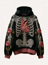 Black hoodie with 3D embroidered skeleton, heart, and floral rose details, relaxed fit.