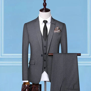 Men's slim-fit three-piece gray suit with white shirt and black tie, formal wear