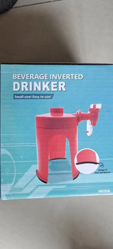 Red plastic inverted beverage dispenser with spout and anti-skid bottom, tabletop size