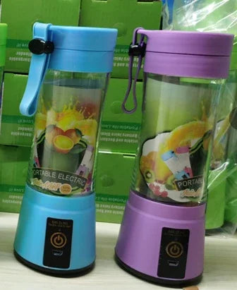 Blue and purple portable electric blenders with clear jars and fruit graphic, countertop display.