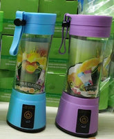 Blue and purple portable electric blenders with clear jars and fruit graphic, countertop display.