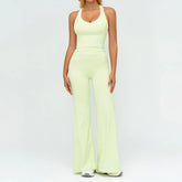 Woman wearing light yellow fitted tank top and wide-leg pants set, soft stretch fabric