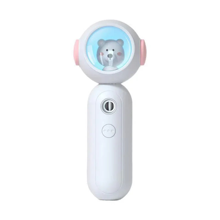 Handheld white electronic device with round top, blue screen, and cartoon bear inside