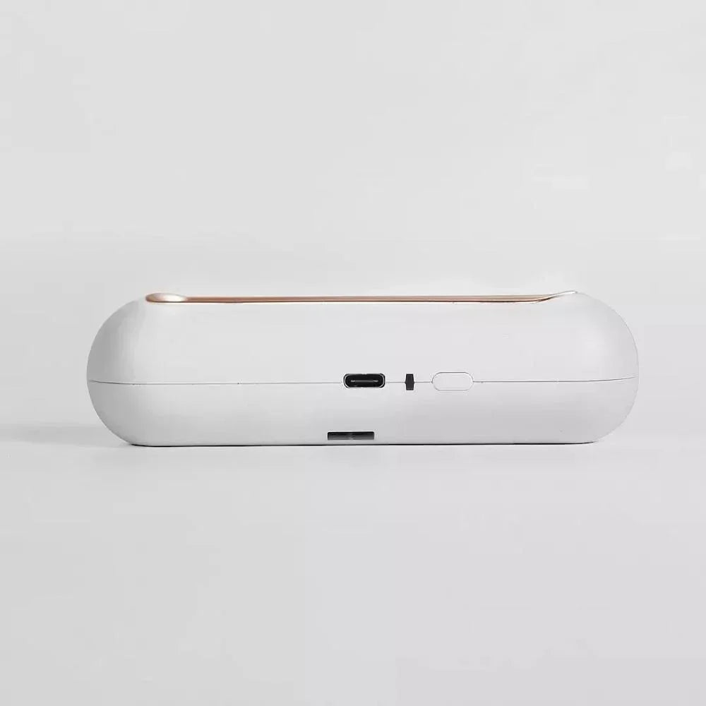 White, minimalist tech accessory with USB-C port, compact and rounded design on white background