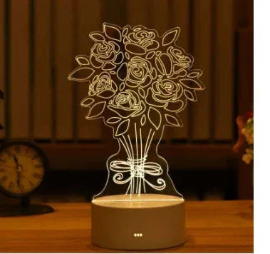 LED 3D night light shaped like a bouquet of roses in a vase, glowing on a wooden table.