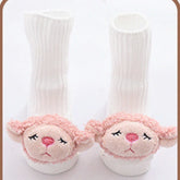 White ribbed baby socks with pink plush animal faces, soft material, cozy fit, cute design