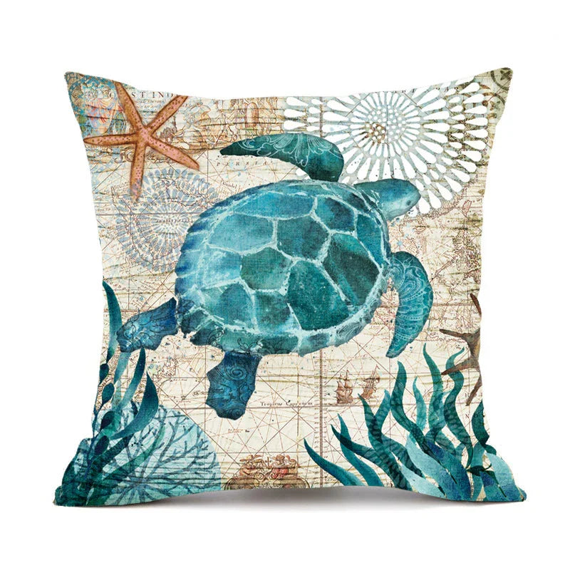 Decorative throw pillow with blue sea turtle, starfish, and ocean plants on a vintage map background