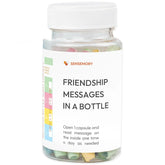 Clear plastic bottle with colorful rolled paper capsules labeled &