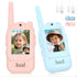Pink and blue walkie talkies with video screens, USB charging cables, kid-friendly design