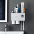 Wall-mounted white bathroom organizer with toothbrush holder, cups, and skincare storage