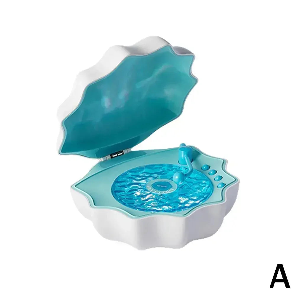 Blue and white clam-shaped jewelry box with glossy interior and circular pattern tray