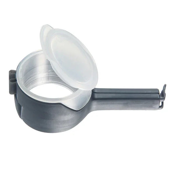 Black and silver plastic egg separator with handle and open lid on white background