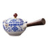 Ceramic pot with blue floral patterns, wooden handle, and a round lid knob