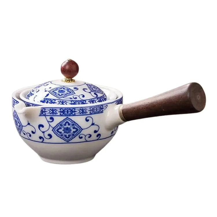 Ceramic pot with blue floral patterns, wooden handle, and a round lid knob
