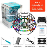 Black spherical drone toy with LED lights, remote control, battery, USB cable, and spare blades