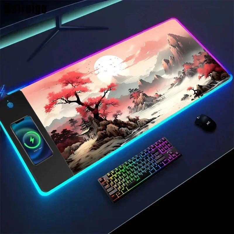 RGB gaming desk mat with cherry blossom landscape, wireless charging pad, and backlit keyboard