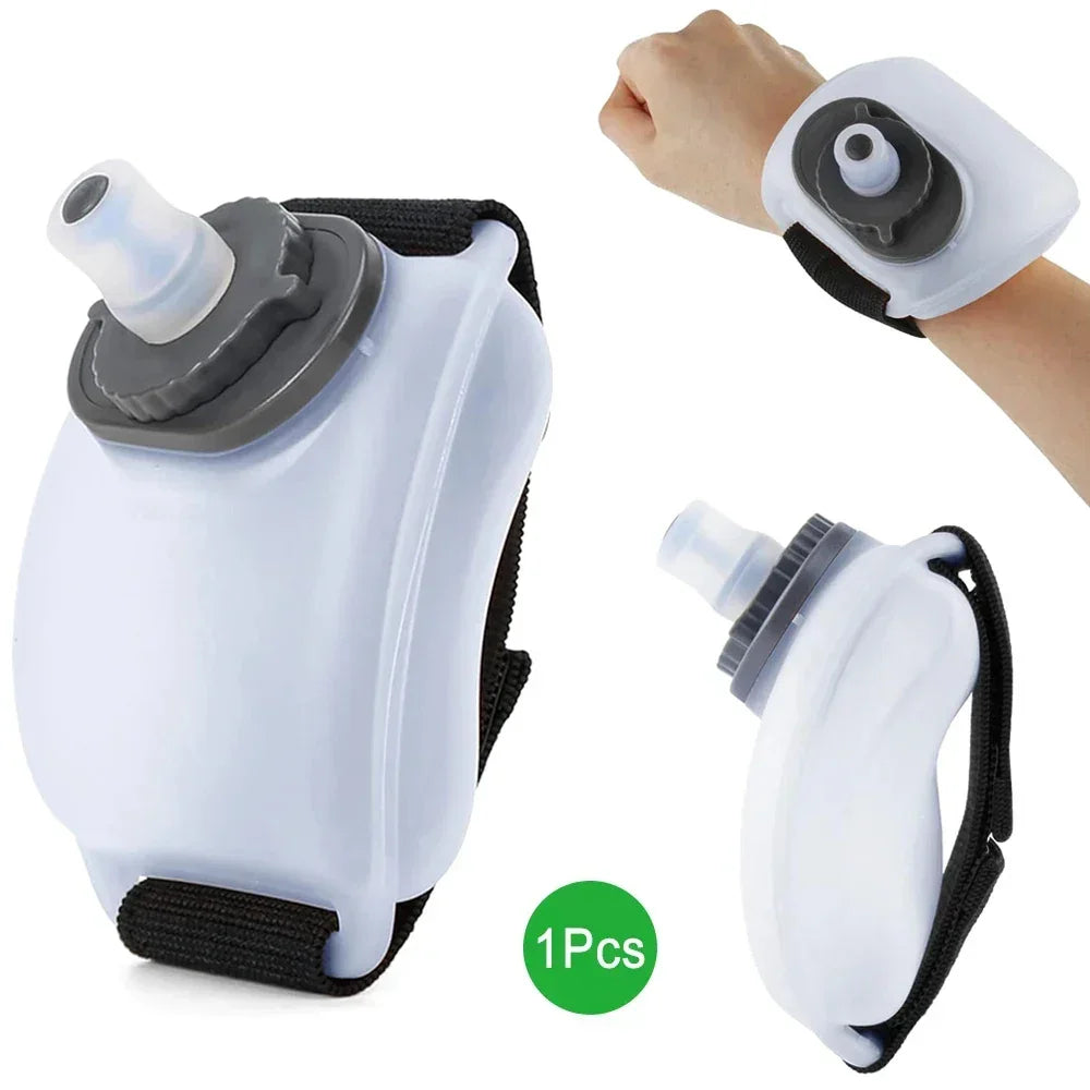 White plastic wrist water bottle with adjustable black strap, compact ergonomic fit