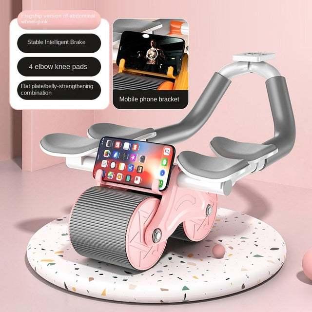 Pink and gray abdominal exercise roller with knee pads and phone holder on terrazzo platform