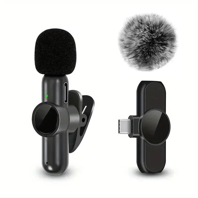 Black wireless lavalier microphone set with USB-C receiver and furry windscreen on white background.