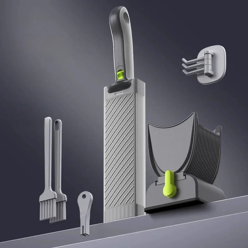 Modern grey and green plastic kitchen tool set with brushes, grater, and holder on dark background