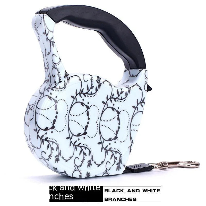 Retractable dog leash with black and white branch pattern, ergonomic plastic handle